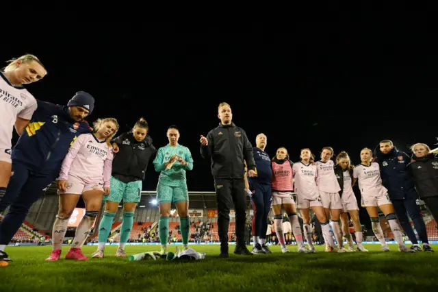 Jonas Eidevall speaks to his players after Arsenal's defeat.