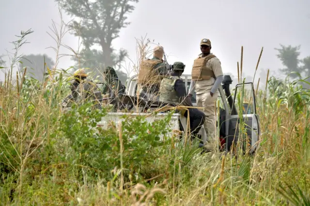 Nigeria security officers fighting against armed gangs in patrol