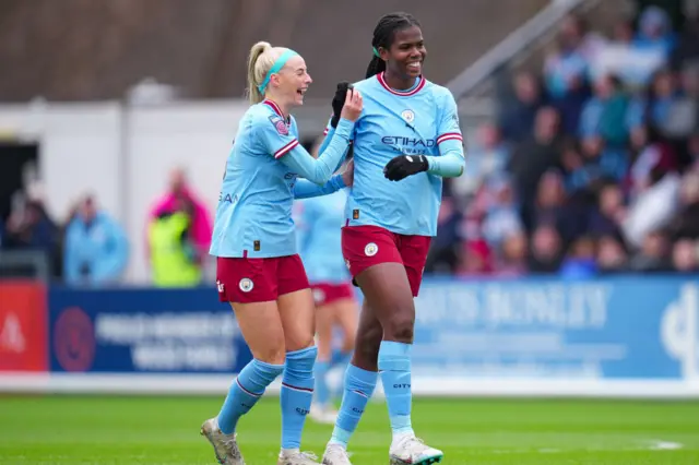 Khadija Shaw and Chloe Kelly smiling after scoring