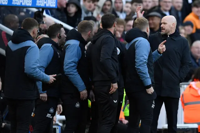 Manchester United's manager Erik ten Hag has words with the Newcastle staff