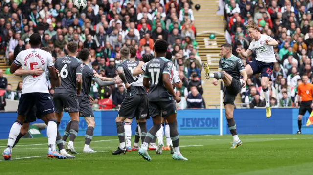 Kyle Dempsey scores with a header for Bolton