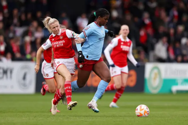 Khadija Shaw of Manchester City is challenged by Leah Williamson of Arsenal