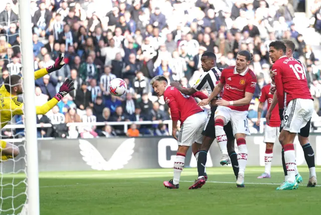 Manchester United goalkeeper David de Gea makes a save from Newcastle United's Alexander Isak