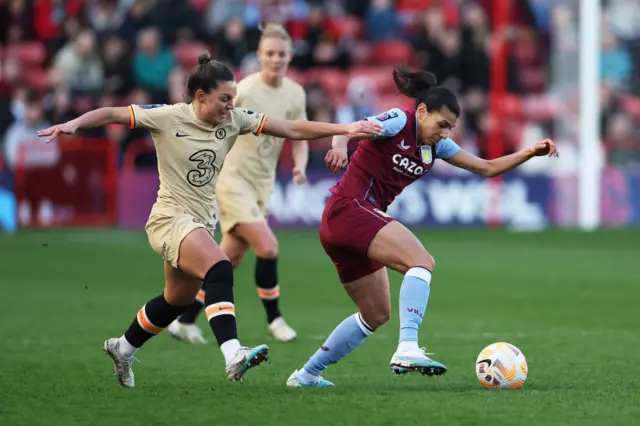 Johanna Rytting Kaneryd of Chelsea battles for possession with Kenza Dali of Aston Villa