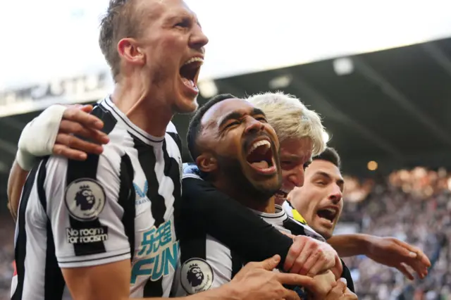 Callum Wilson of Newcastle United celebrates with teammates