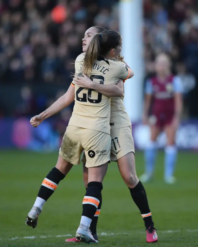 Guro Reiten of Chelsea hugs teammate Jelena Cankovic after scoring her team's second goal