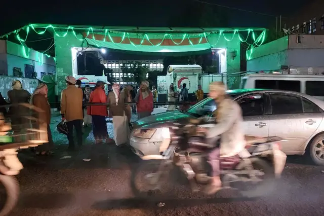 People outside a hospital in Sanaa