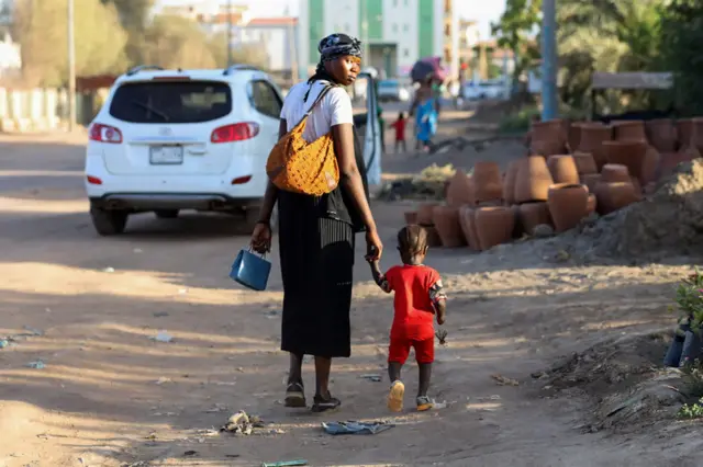 People flee their neighbourhoods amid fighting between the army and paramilitaries in Khartoum on April 19, 2023,