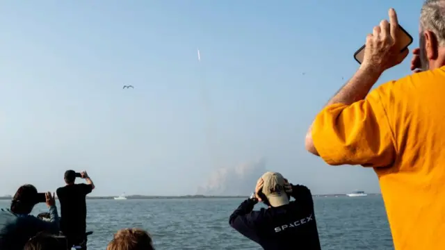 Spectators watch from South Padre Island, Texas