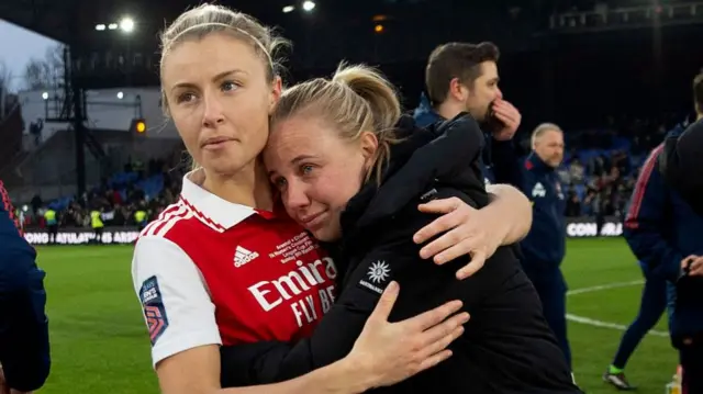 Arsenal and England's Leah Williamson hugs team-mate Beth Mead