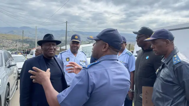 The police minister and top police commanders visiting the crime scene in KwaZulu-Natal province