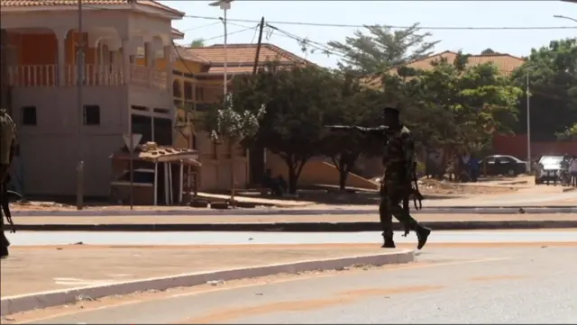 A soldier patrol the government palace area in Bissau, capital of Guinea-Bissau, on 1 February, 2022.