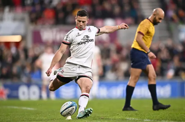 John Cooney kicks at goal