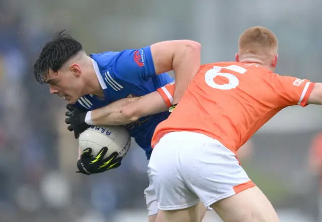 Oisin Brady of Cavan in action against Ciaran Mackin of Armagh