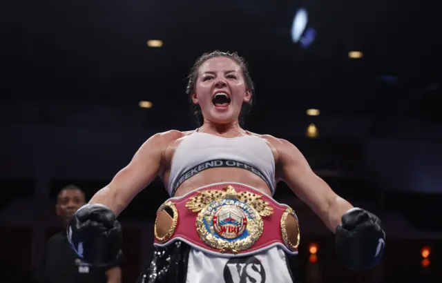 Sandy Ryan celebrates with her WBO world title