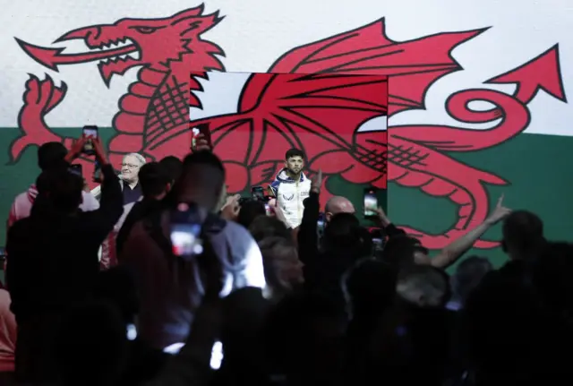 Dafydd Iwan and Joe Cordina make their entrance at a fight