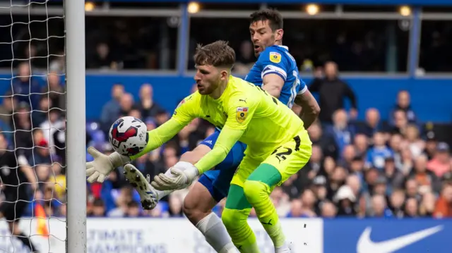 Blackpool keeper Dan Grimshaw scoops up the ball