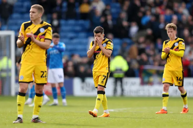 Rochale players look dejected after their relegation is confirmed