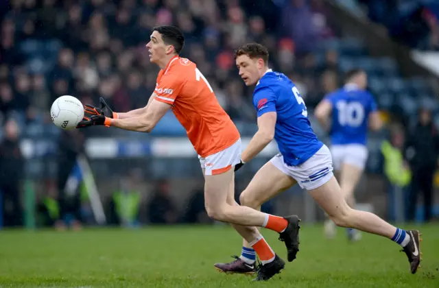 Rory Grugan of Armagh in action against Ciarán Brady of Cavan