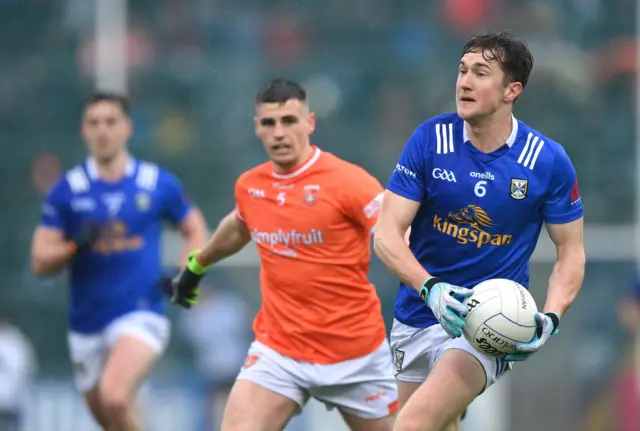 Oisin Kiernan of Cavan in action against Greg McCabe of Armagh