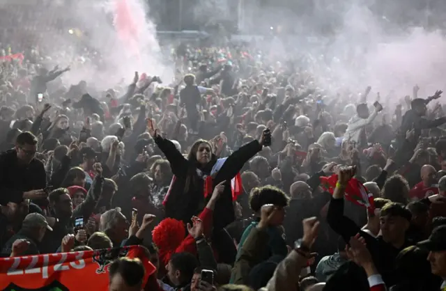 Wrexham fans celebrate at the pitch