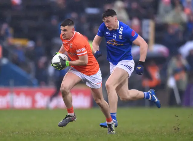 Greg McCabe of Armagh in action against Conor Brady of Cavan