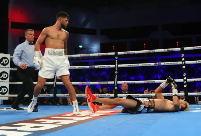 Joe Cordina stands over a downed Kenichi Ogawa