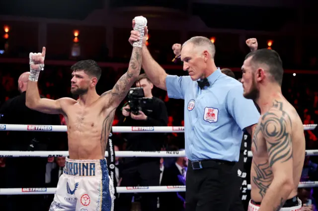 Joe Cordina is announced the winner and has his hand raised