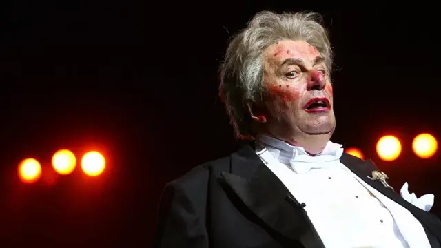 Humphries as Sir Les Patterson performing at the Royal Albert Hall