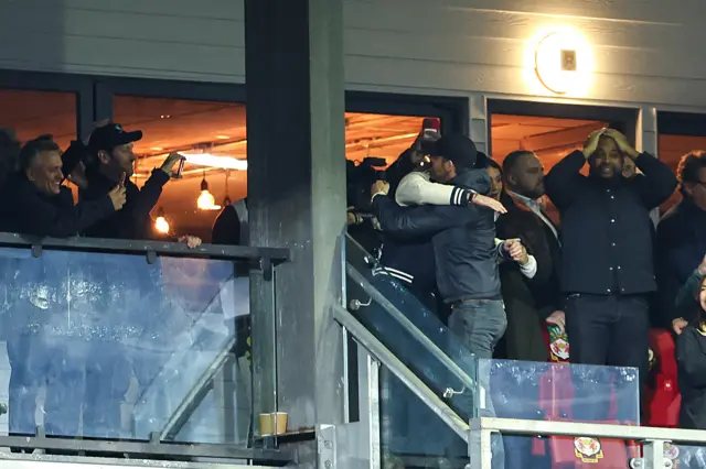 Wrexham owners hug in director's box