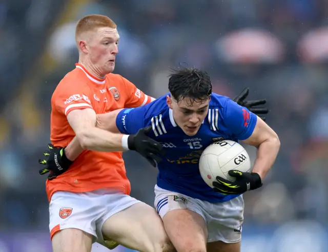 Oisin Brady of Cavan in action against Ciaran Mackin of Armagh