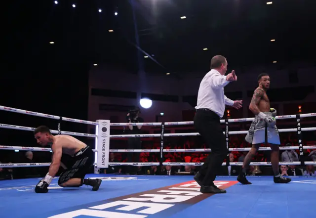 Zelfa Barrett is ushered away by the referee after knocking down his opponent