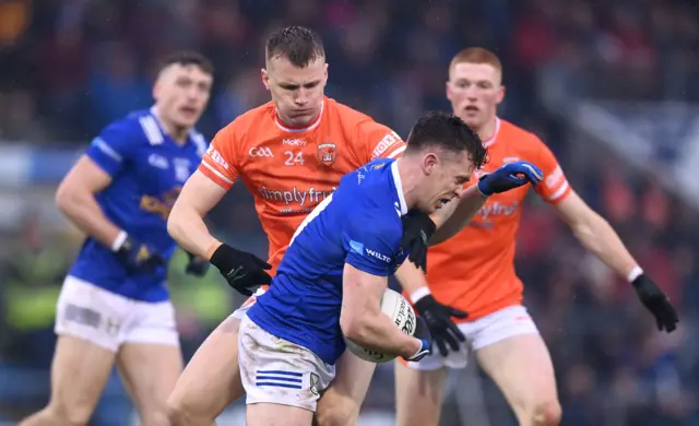 Dara McVeety of Cavan in action against Rian O'Neill of Armagh