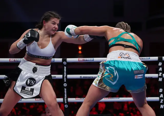 Sandy Ryan punches her opponent