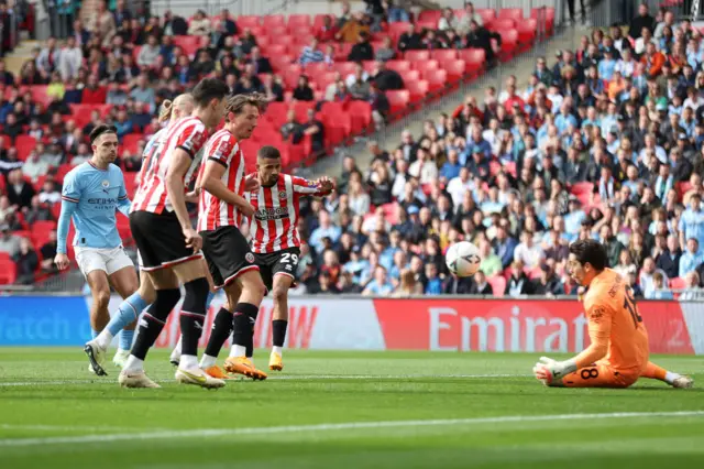 Iliman Ndiaye of Sheffield United shoots at Stefan Ortega