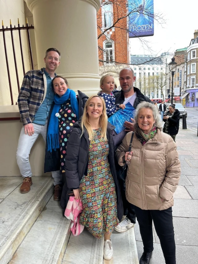 Jasmine pictured outside the Theatre Royal, showing Frozen the musical, in central London