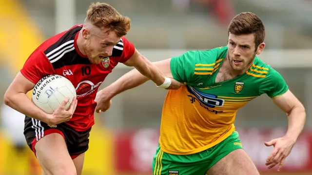 Down's Liam Kerr and Donegal's Eoghan Ban Gallagher battle in the 2021 Ulster opener at Newry