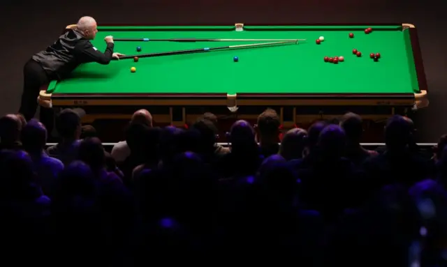 John Higgins during day nine of the World Snooker Championship at the Crucible Theatre