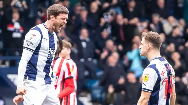 John Swift celebrates scoring a penalty against Sunderland