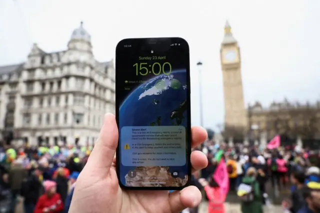 A phone with the alert in Parliament Square, London