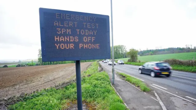 An electronic road sign in Bath, warns motorists of the impending emergency national alert system warning