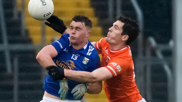 Armagh's Jarlath Og Burns battles with Cavan's Cian Madden at Kingspan Breffni