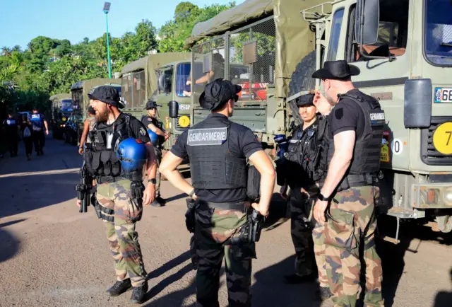 French gendarmes patrol in a street after clashes broke out in Majicavo, a commune part of Koungou city, Mayotte - 25 April 2023