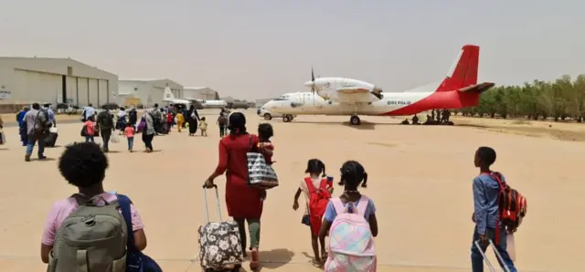 People waiting to be evacuated from Sudan