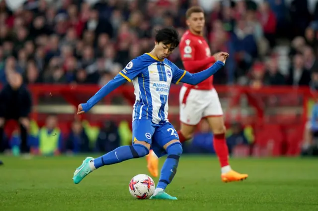 Brighton's Kaoru Mitoma passes the ball against Nottingham forest