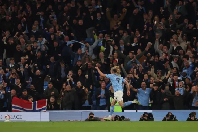 Erling Haaland celebrates scoring Manchester City's fourth goal against Arsenal