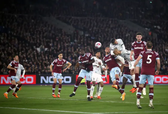 Liverpool's Virgil van Dijk wins a header against West Ham