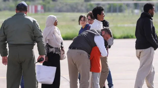 Greek and other nationals arriving in Athens