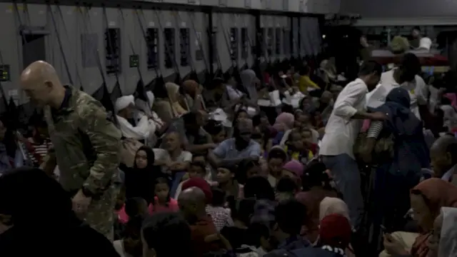 People waiting onboard an RAF aircraft for evacuation to Larnaca International Airport in Cyprus