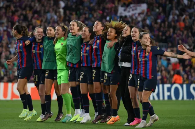 Barcelona players celebrate after beating Chelsea in Women's Champions League semi-final at the Nou Camp